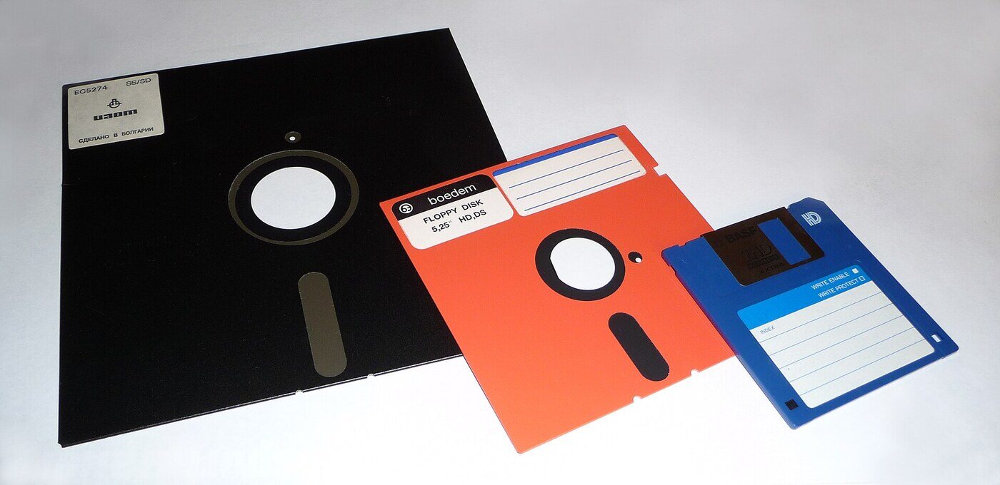 The three sizes side by side: an 8-inch disk from the 1970s, a 5.25-inch from the PC and Apple II years, and the 3.5-inch that lasted until 2011.