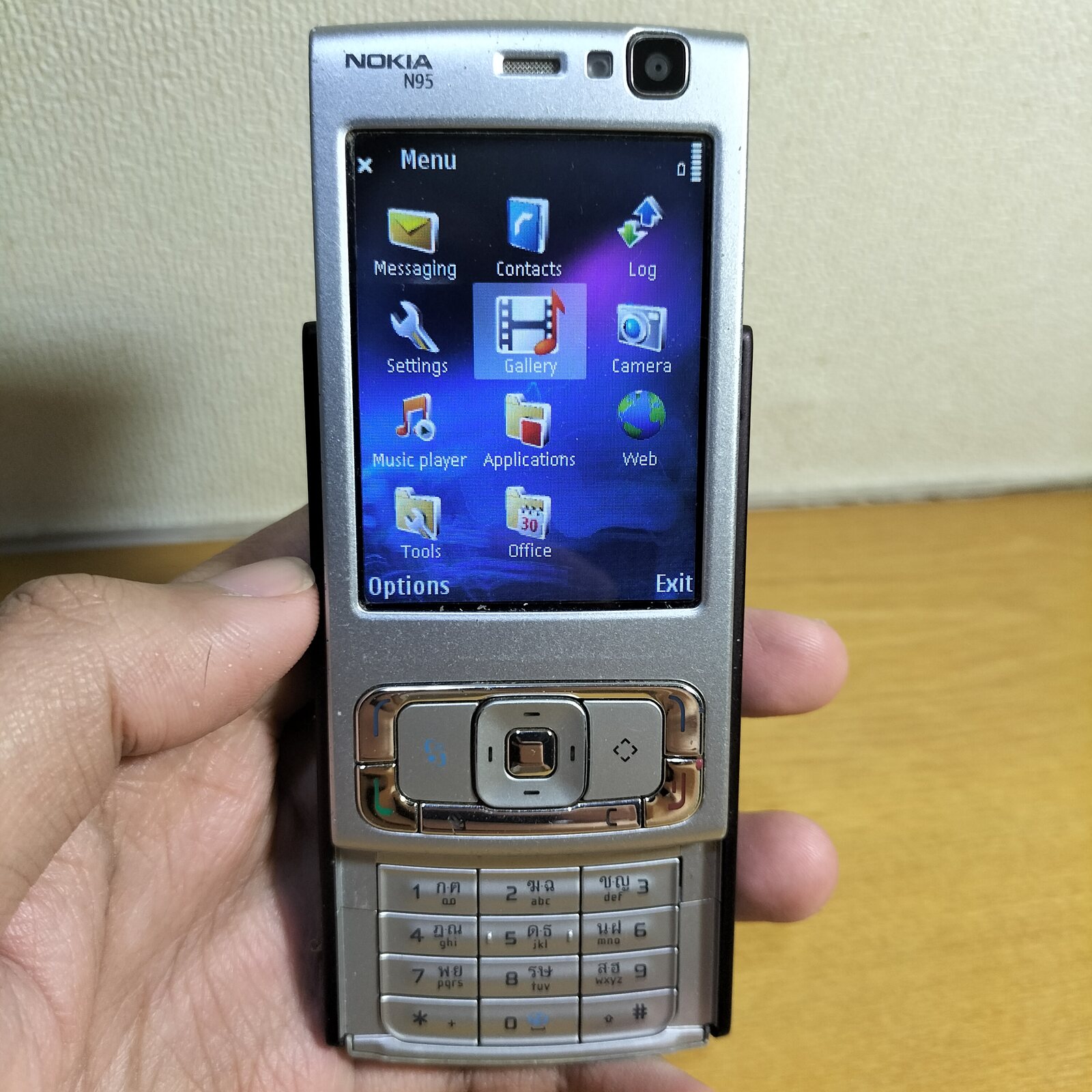 The Nokia N95 of 2007, slide open on the S60 menu. Symbian at its commercial peak.