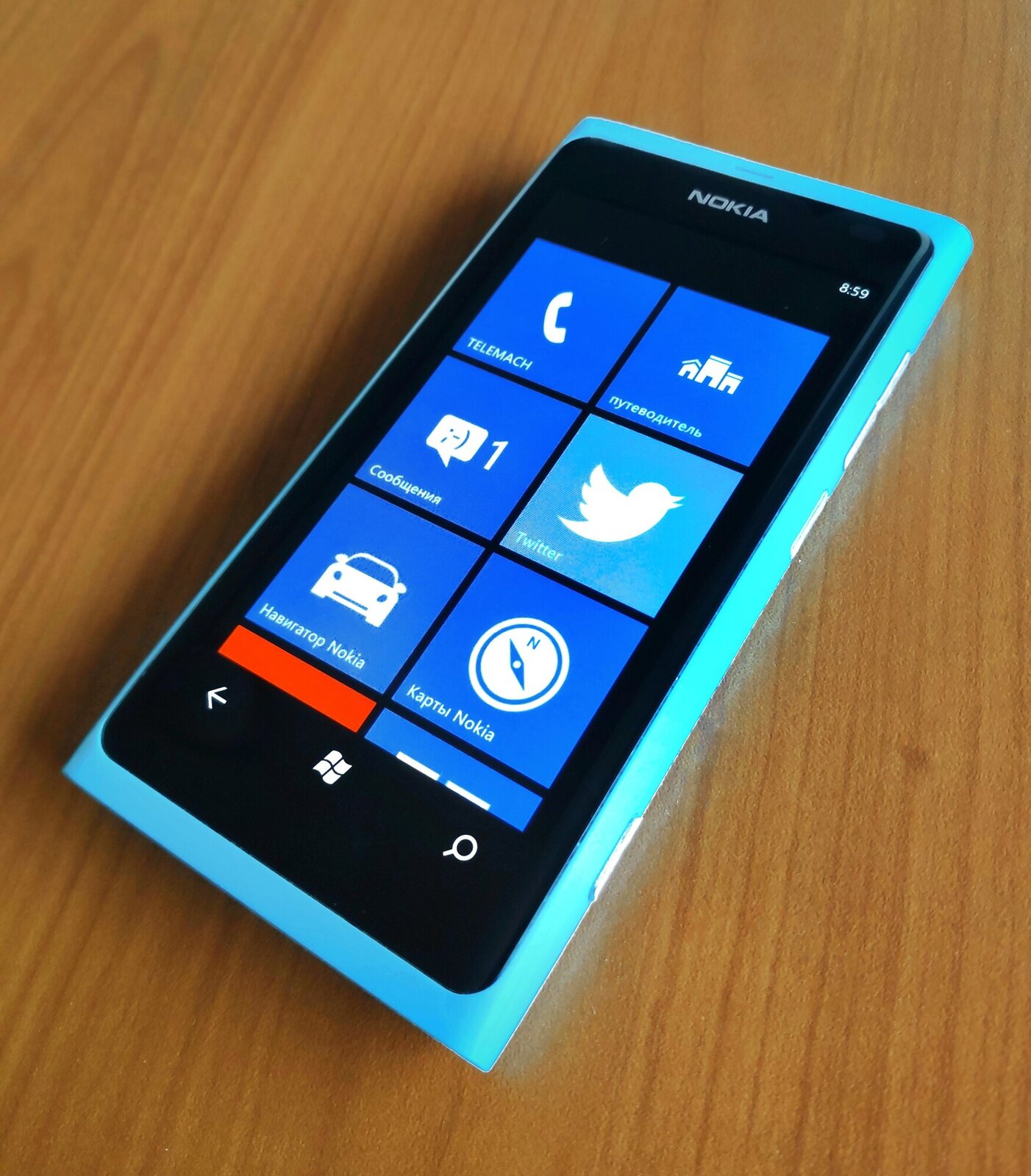 The Lumia 800 of 2011 in cyan: the N9's polycarbonate body with Windows Phone inside.