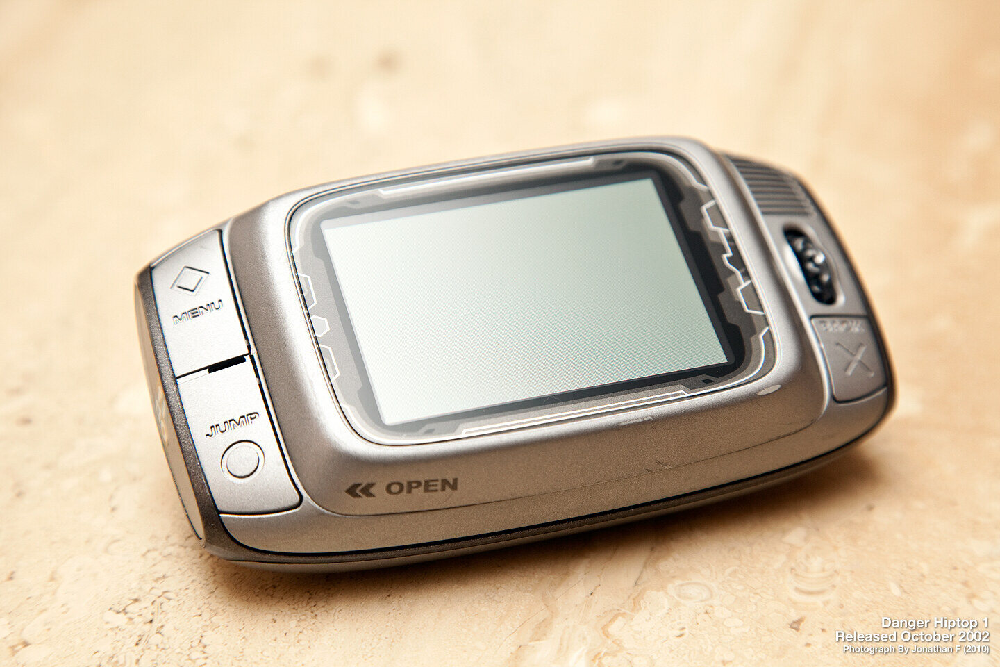 The original Danger Hiptop, sold as the T-Mobile Sidekick from October 2002, screen closed over the keyboard.