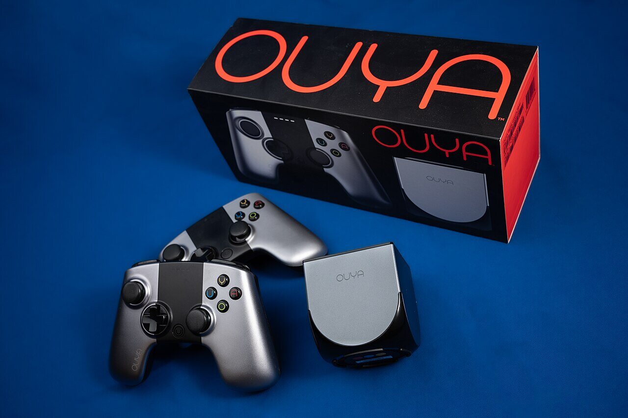 The Ouya console with its controllers